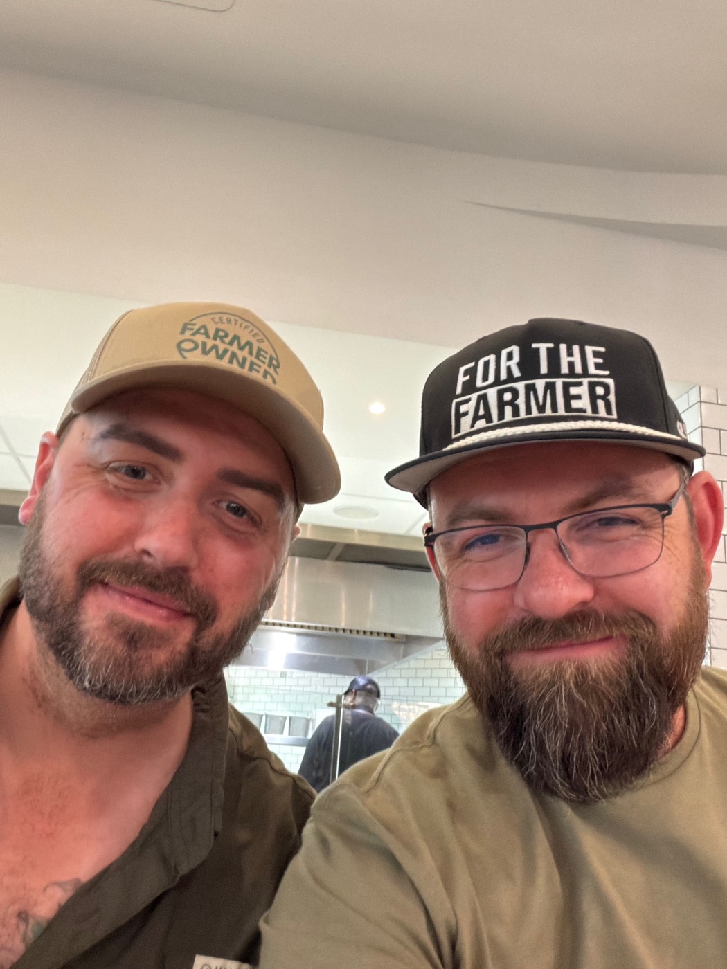 Robbie and Tyler, founders, on the farm